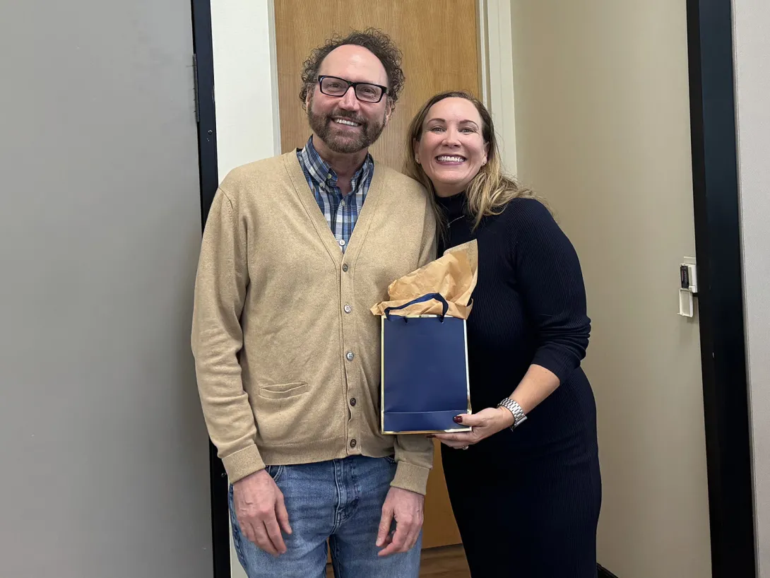 Michael Best, executive director of IPaT, presents Gillian Hayes with a gift bag before her IPaT distinguished alumnus talk on Oct. 17, 2024