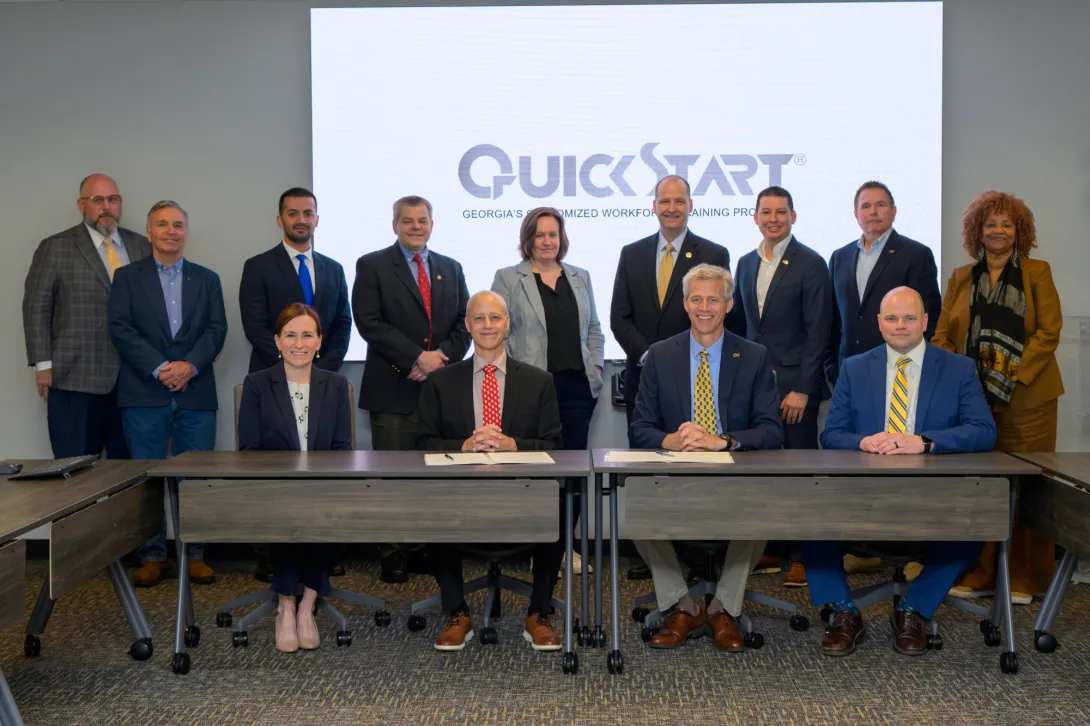 Georgia Quick Start Deputy Commissioner Scott McMurray (center left) and Georgia Tech Executive Vice President for Research Tim Lieuwen (center right) gathered with members of the Georgia Tech Manufacturing Institute, Georgia AIM, and more to officially commemorate the partnership on April 8.