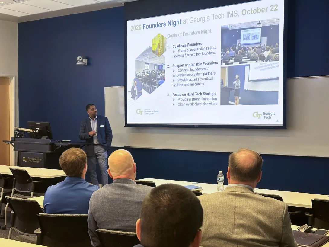 Billyde Brown addresses attendees beneath a slide outlining goals for 2026 Founders Night at Georgia Tech IMS, including celebrating, supporting, and enabling founders.