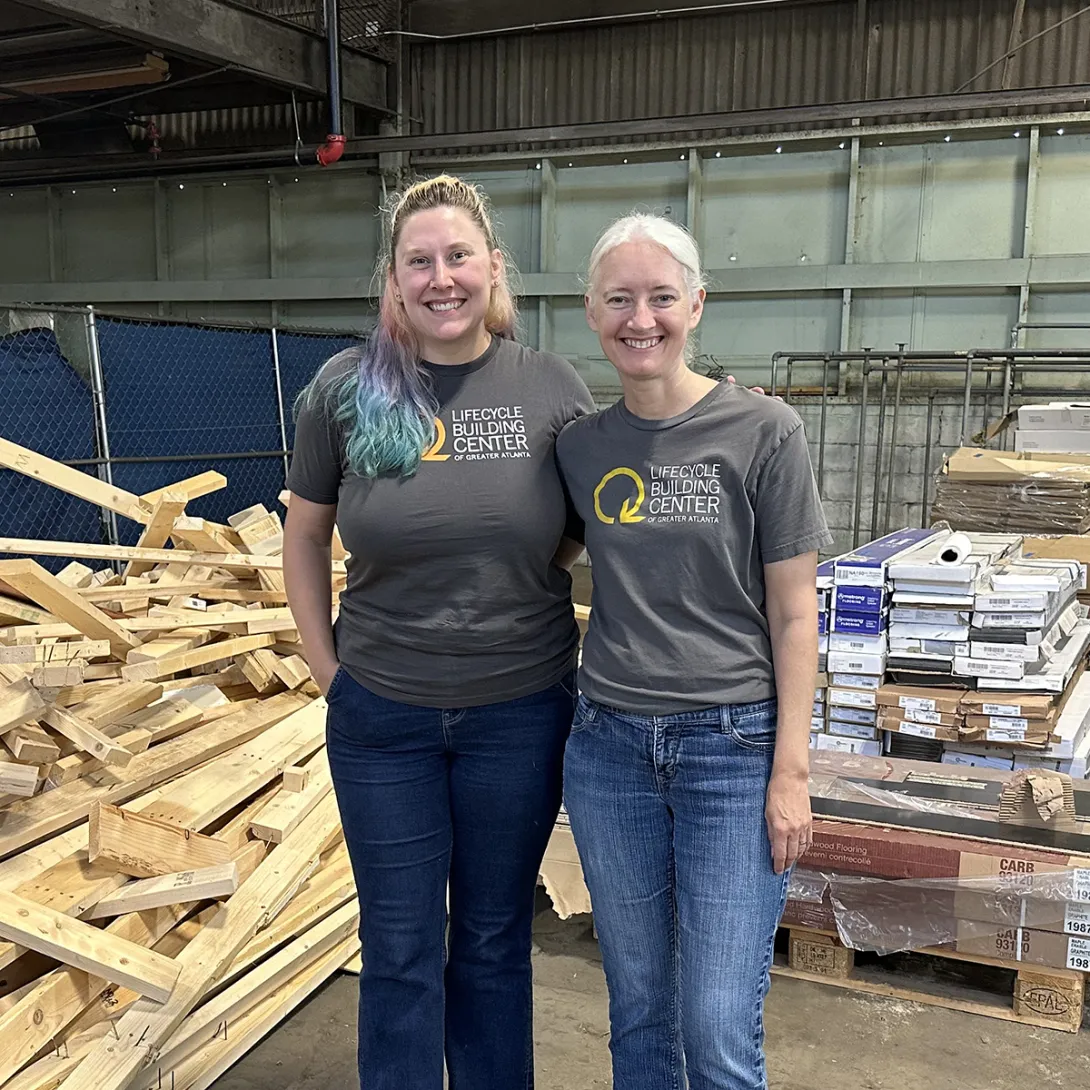 Georgia Tech intern Morgan Hale and Lifecyle Building Center Executive Director Shannon Goodman stand in a warehouse.