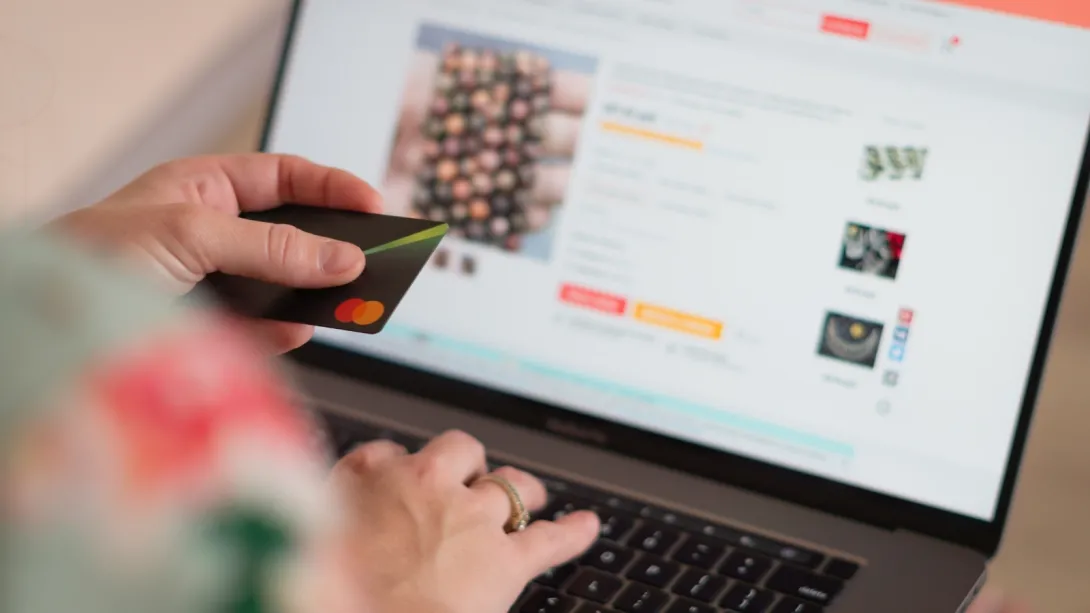 Stock photo of person shopping online with a credit card
