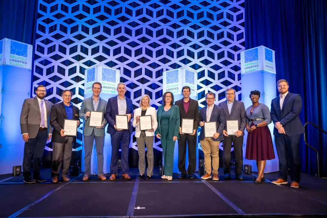 Members of the Georgia Center of Innovation – Logistics Advisory Board gathered at the 2025 Georgia Logistics Summit, where each received a personal note of recognition from Governor Brian Kemp for three years of dedicated service. Their collective efforts have advanced freight and logistics across Georgia—strengthening collaboration between industry, government, and academia to drive the state’s economic growth.