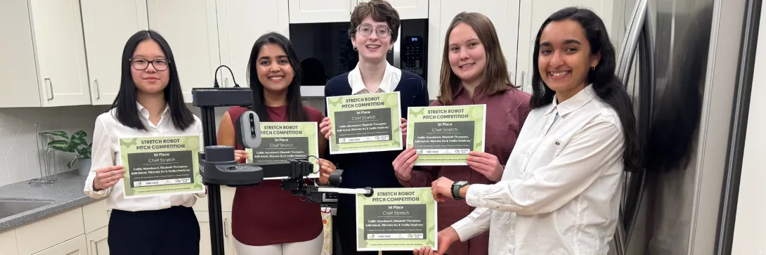 Michelle Gu, Aditi Ashok, Caitlin Woodward, Elizabeth Thompson, and Vedita Sawhney pose with Stretch and their award certificates. They won $1000 and the opportunity to develop their concept in the Aware Home. 