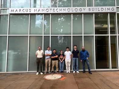 Student researchers stand outside the Marcus Nanotechnology Building on the Georgia Tech campus.
